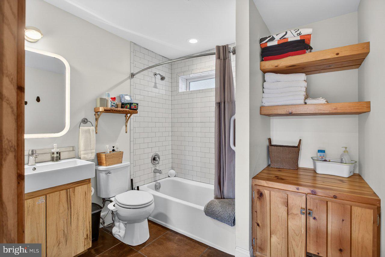 6261 South Page Valley Road Luray, VA 22835 - Photo 25 of 55 a bathroom with a sink toilet and shower