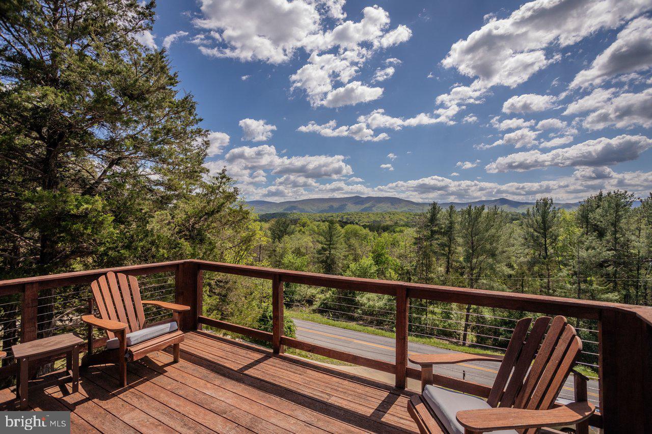 6261 South Page Valley Road Luray, VA 22835 - Photo 37 of 55 a view of a balcony with wooden floor and outdoor seating