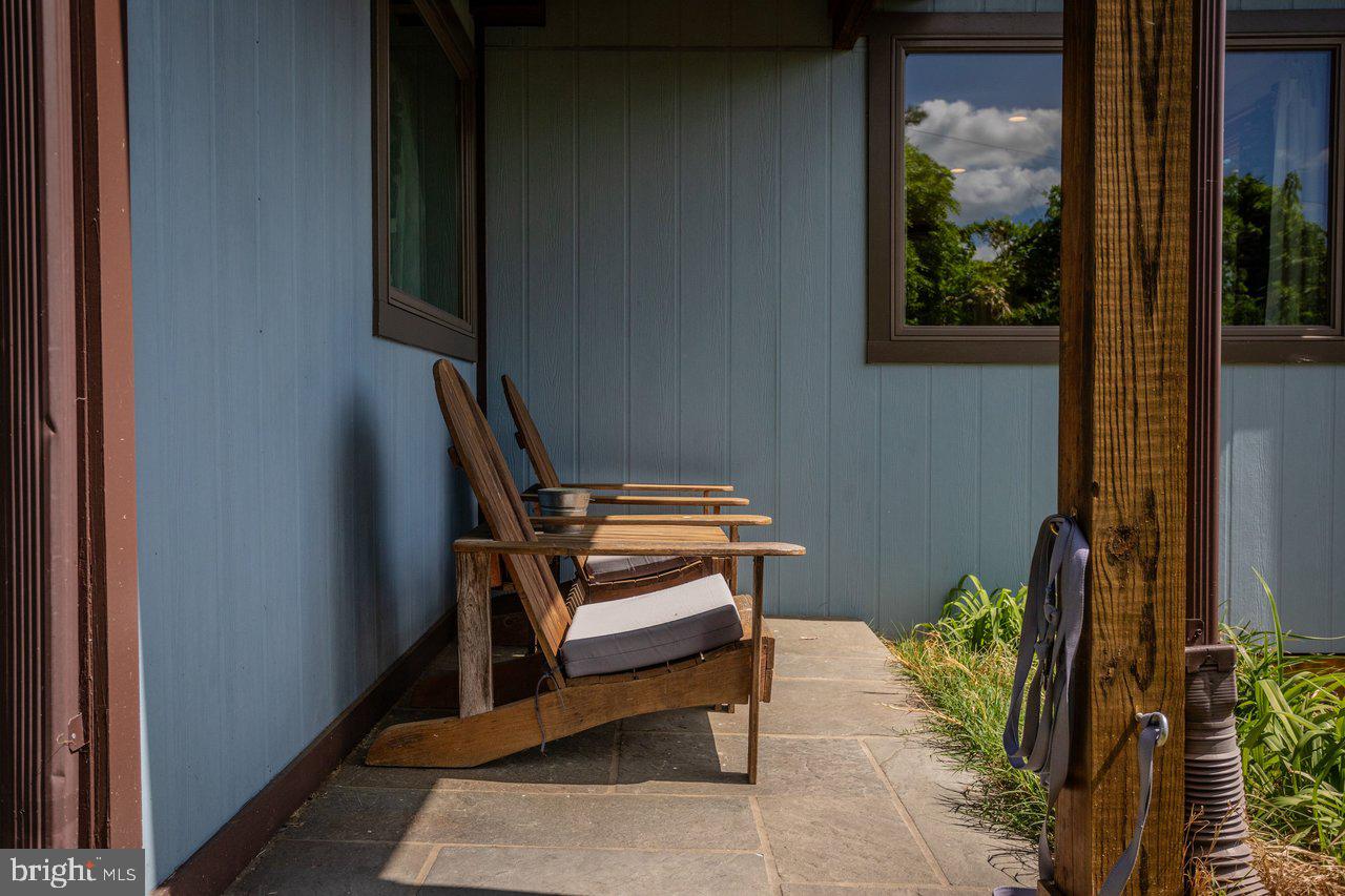 6261 South Page Valley Road Luray, VA 22835 - Photo 41 of 55 a wooden bench sitting in front of a window