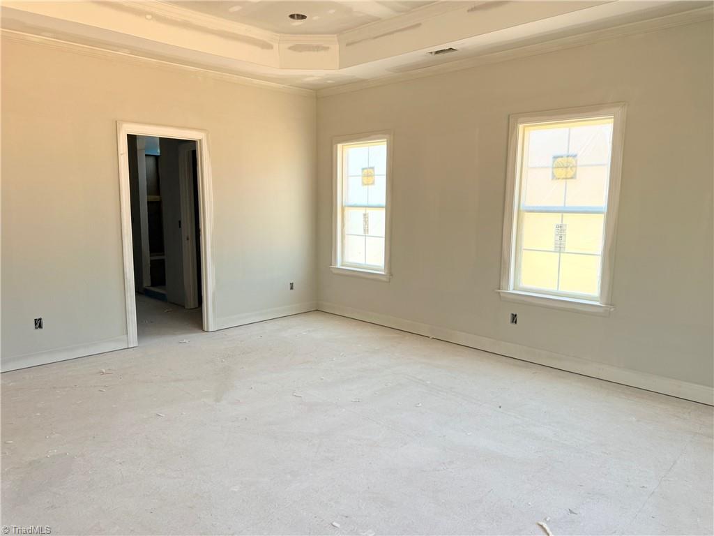 8307 Pyramid Drive Summerfield, NC 27358 - Photo 15 of 29 Primary bedroom view into ensuite bathroom