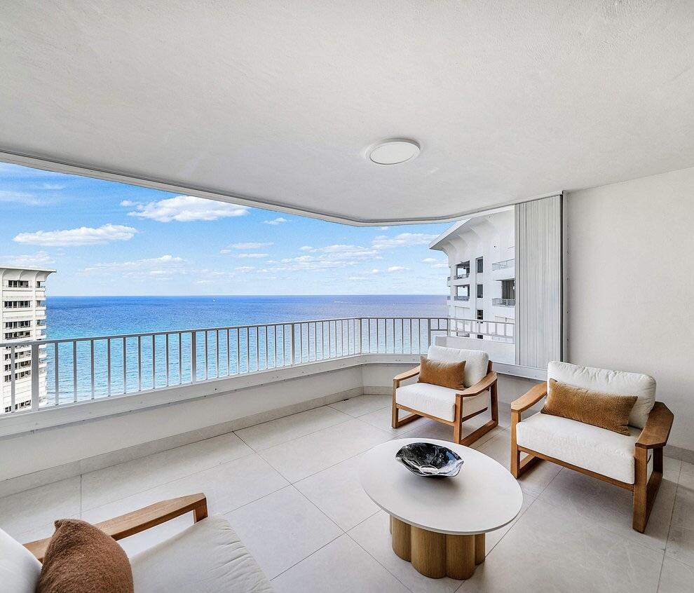 550 South Ocean Boulevard, Unit 2207 Boca Raton, FL 33432 - Photo 16 of 42 a living room with furniture and a rug