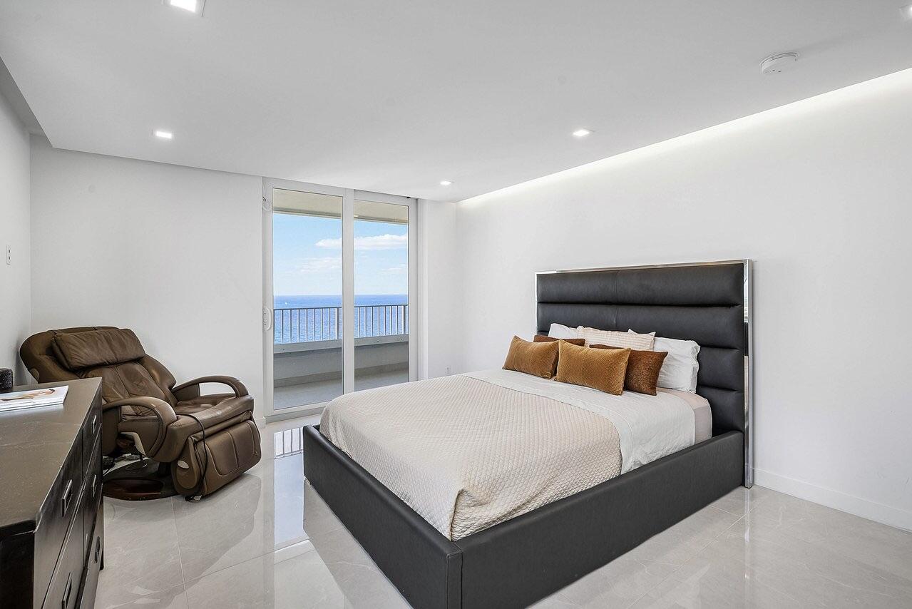 550 South Ocean Boulevard, Unit 2207 Boca Raton, FL 33432 - Photo 19 of 42 a bedroom with a bed and a window