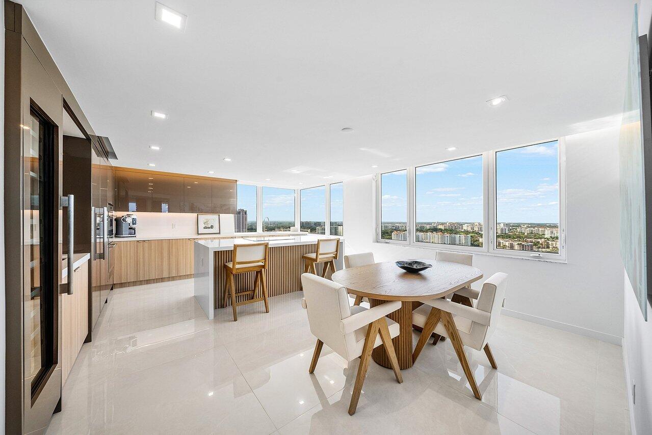 550 South Ocean Boulevard, Unit 2207 Boca Raton, FL 33432 - Photo 2 of 42 a dining room with a table and chairs