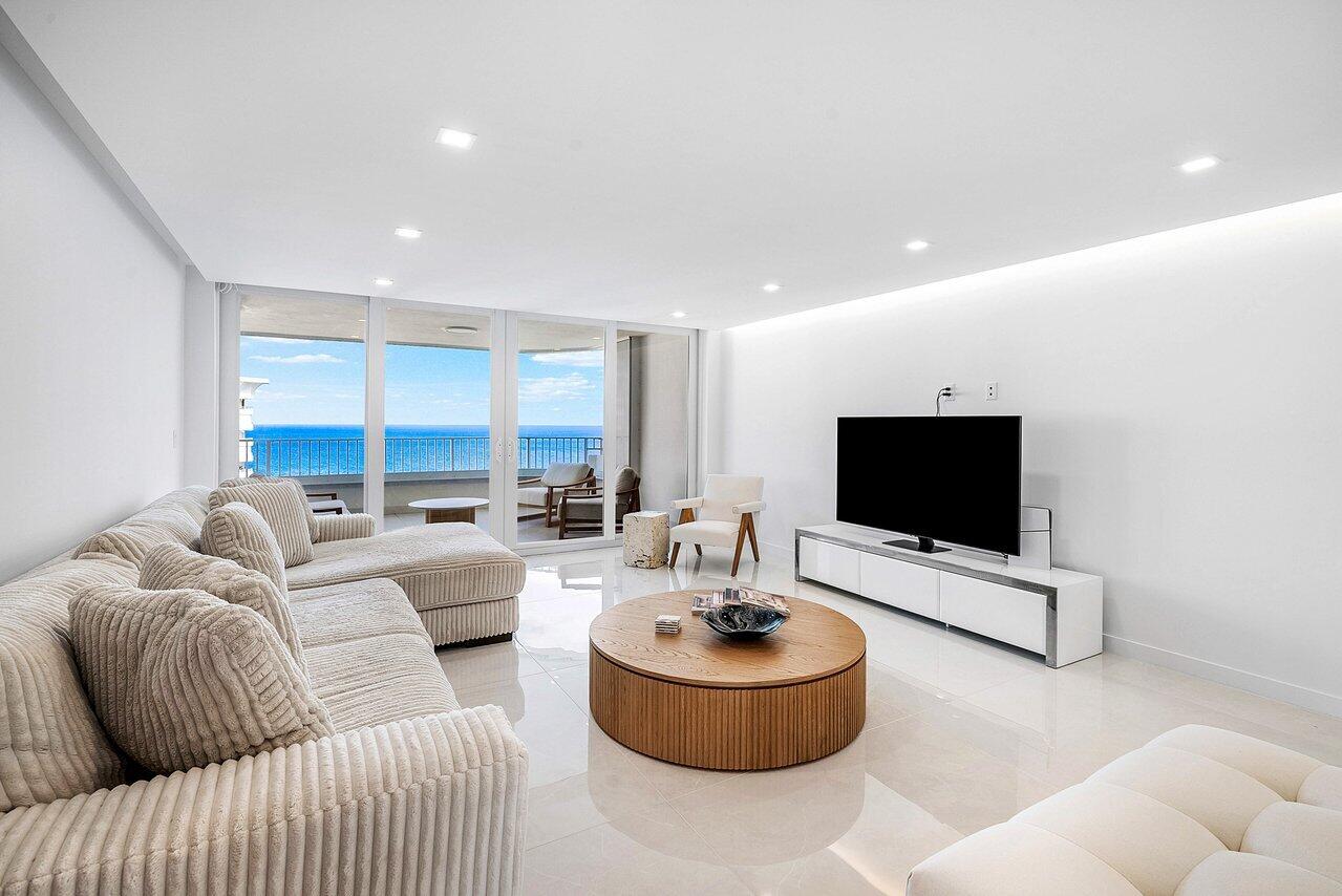 550 South Ocean Boulevard, Unit 2207 Boca Raton, FL 33432 - Photo 8 of 42 a living room with furniture and a flat screen tv