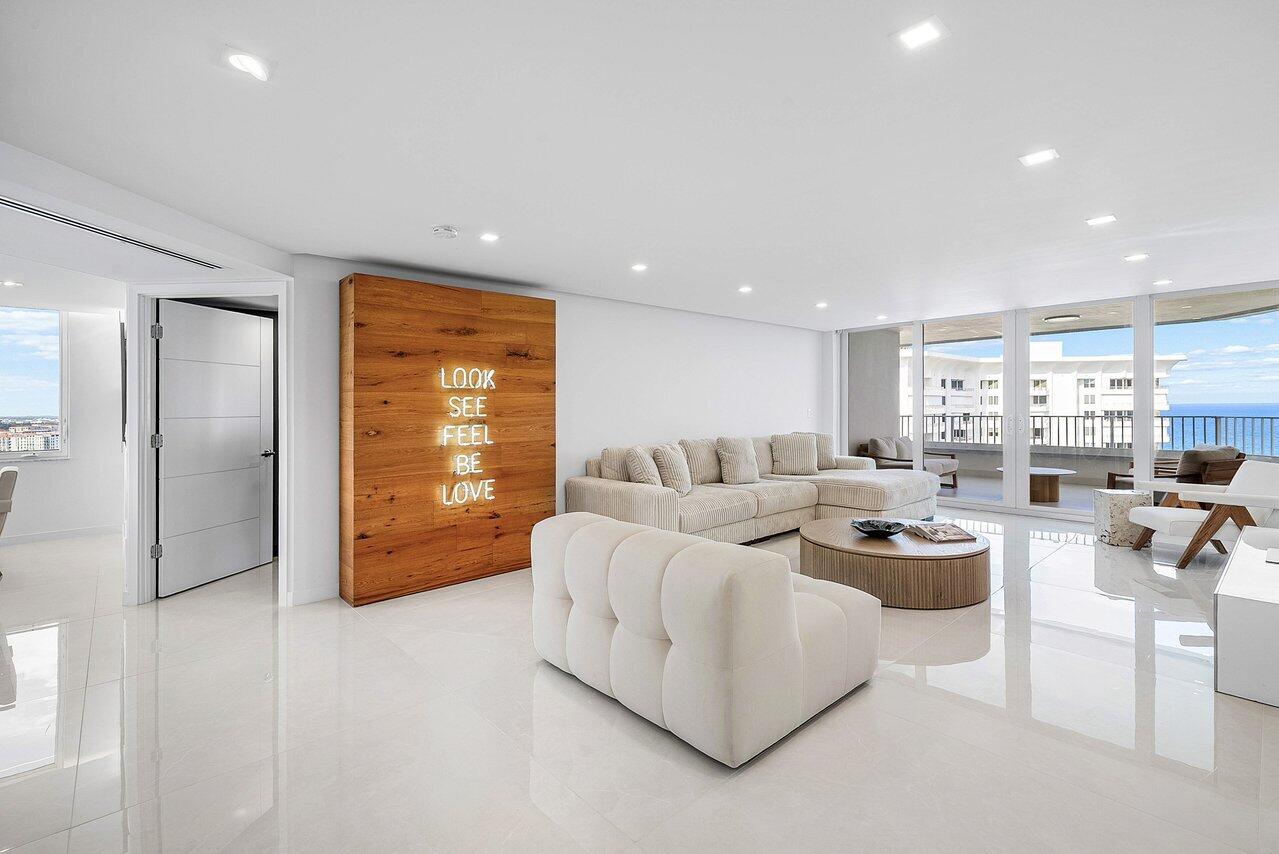550 South Ocean Boulevard, Unit 2207 Boca Raton, FL 33432 - Photo 9 of 42 a living room with furniture and a large window