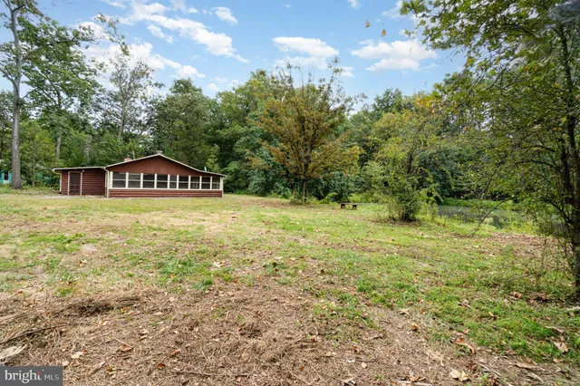 a view of lake with green space