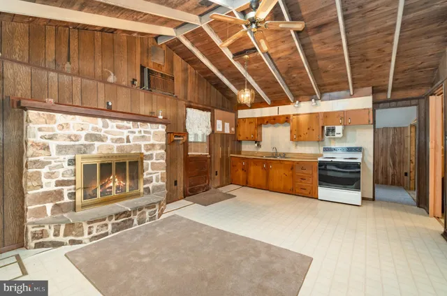 a big room with wooden walls and sliding door