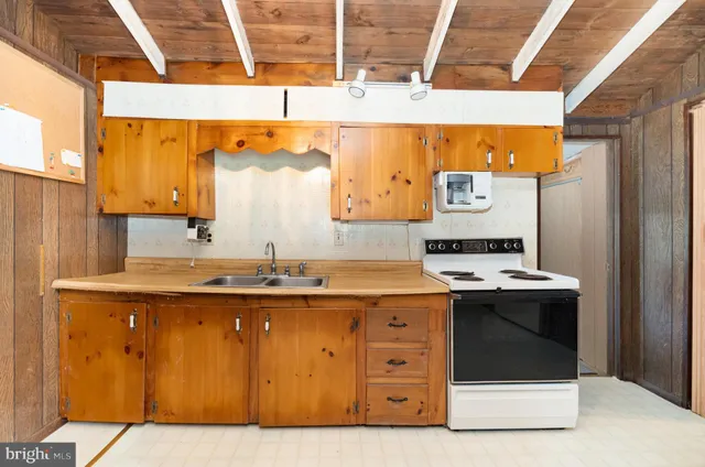 a view of a room with a wooden door