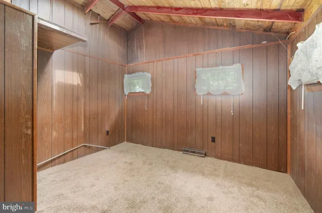a view of door with wooden floor