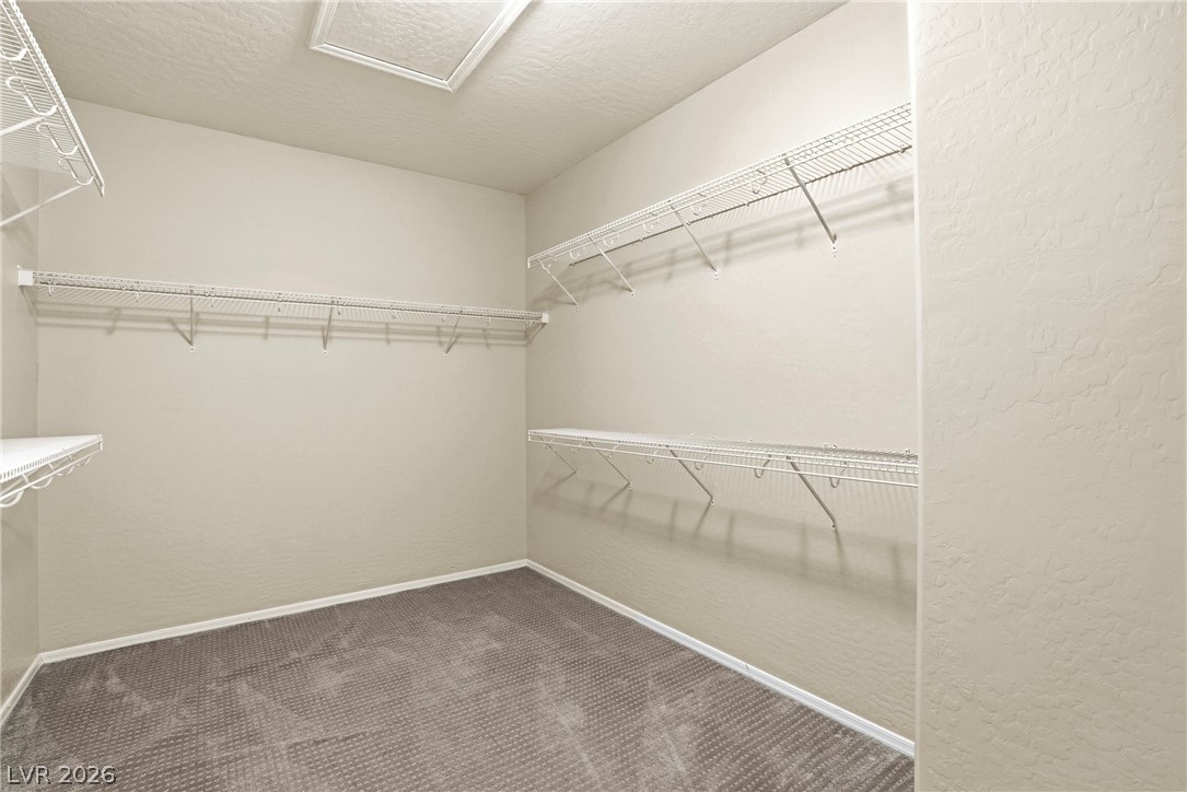 2541 Darda Street Henderson, NV 89044 - Photo 19 of 26 This spacious closet features ample storage solutions for an organized wardrobe.