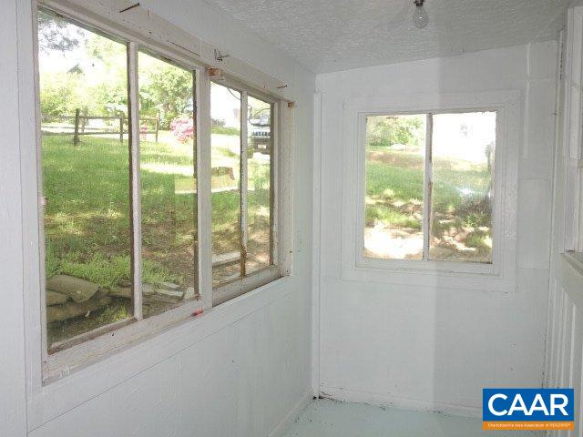 2208 Salem Road Schuyler, VA 22969 - Photo 12 of 21 a view of an empty room with wooden floor and a window
