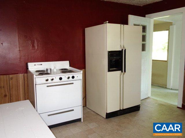 2208 Salem Road Schuyler, VA 22969 - Photo 4 of 21 a white refrigerator freezer sitting inside of a kitchen