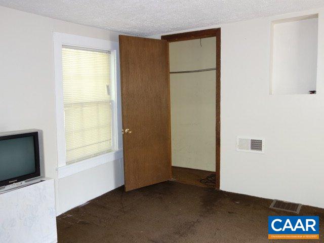 2208 Salem Road Schuyler, VA 22969 - Photo 10 of 21 a view of an empty room with a window and a kitchen