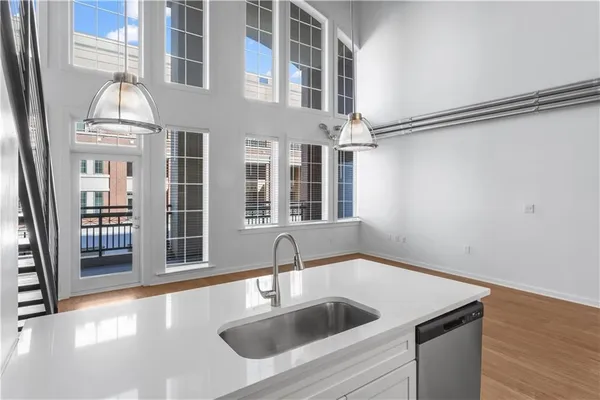 a kitchen with a sink and chandelier
