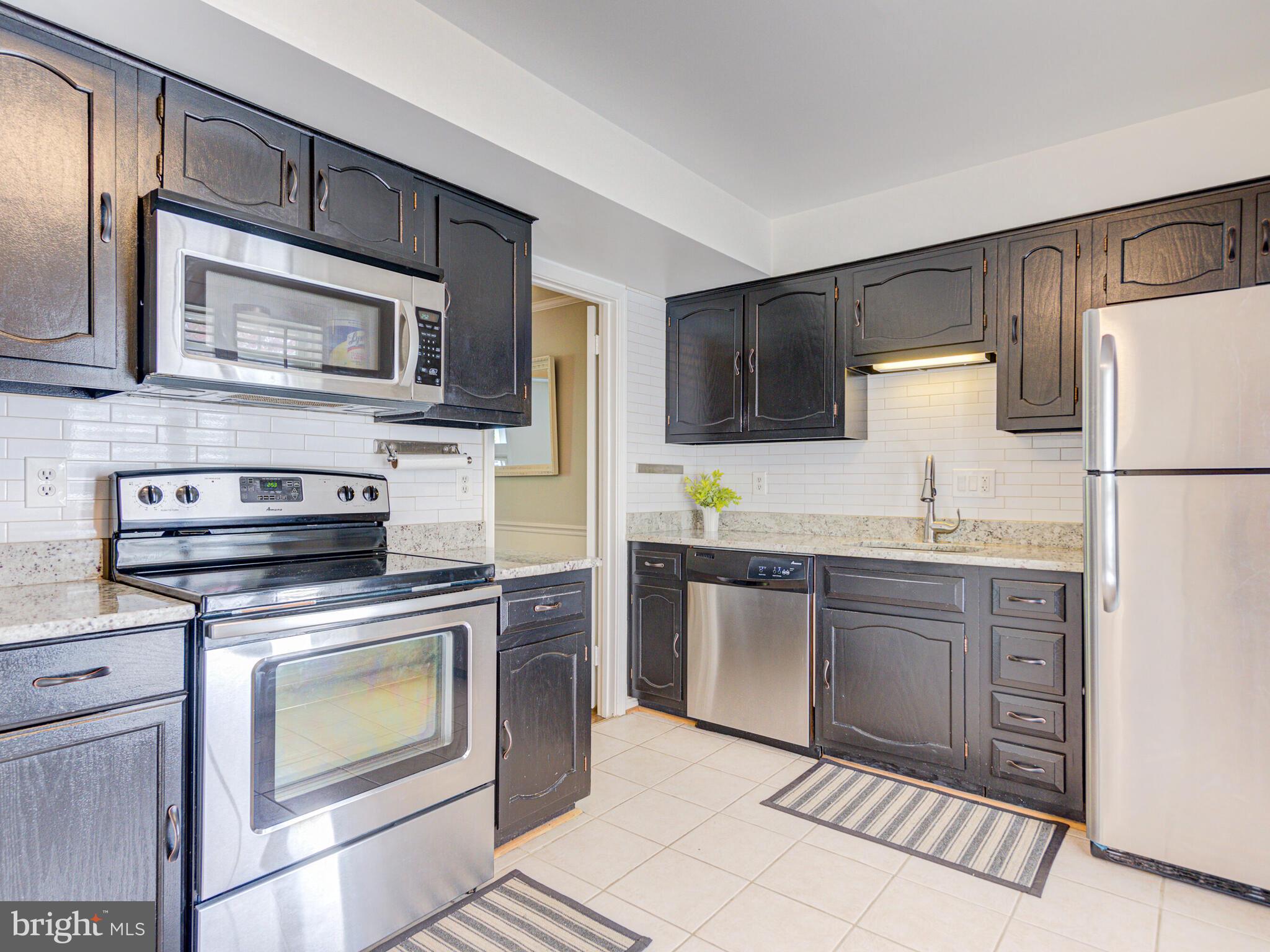 Stainless Steel appliances and plenty of cabinets