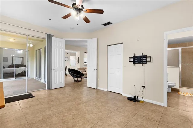 a view of a livingroom with a furniture and a ceiling fan