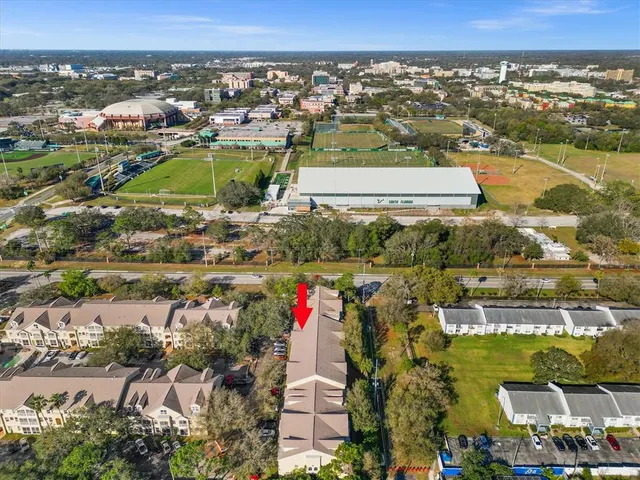 an aerial view of residential building and lake