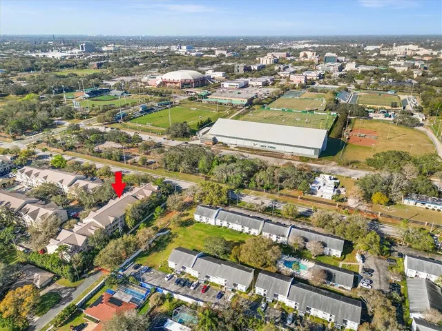 an aerial view of residential houses with outdoor space