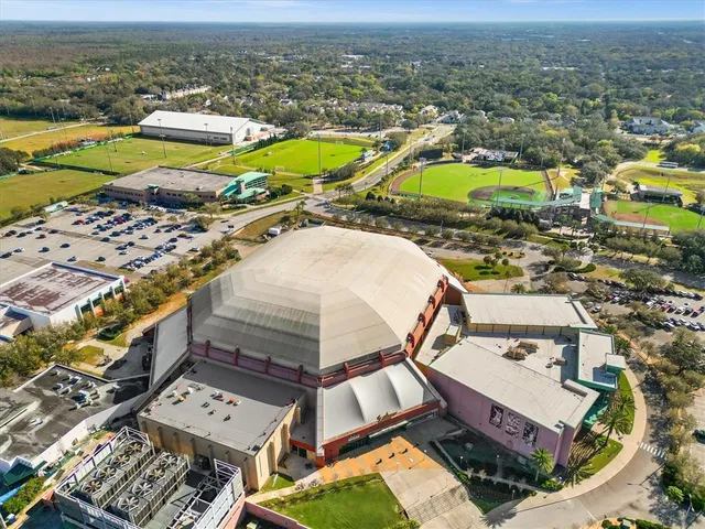 an aerial view of a house with a ocean view