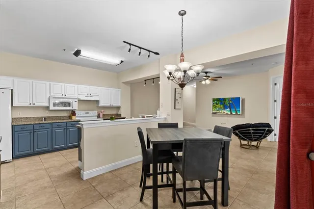 a kitchen with a table and chairs in it