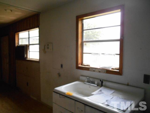 3837 Edgemont Road Wendell, NC 27591 - Photo 7 of 10 a bathroom with a sink and a window