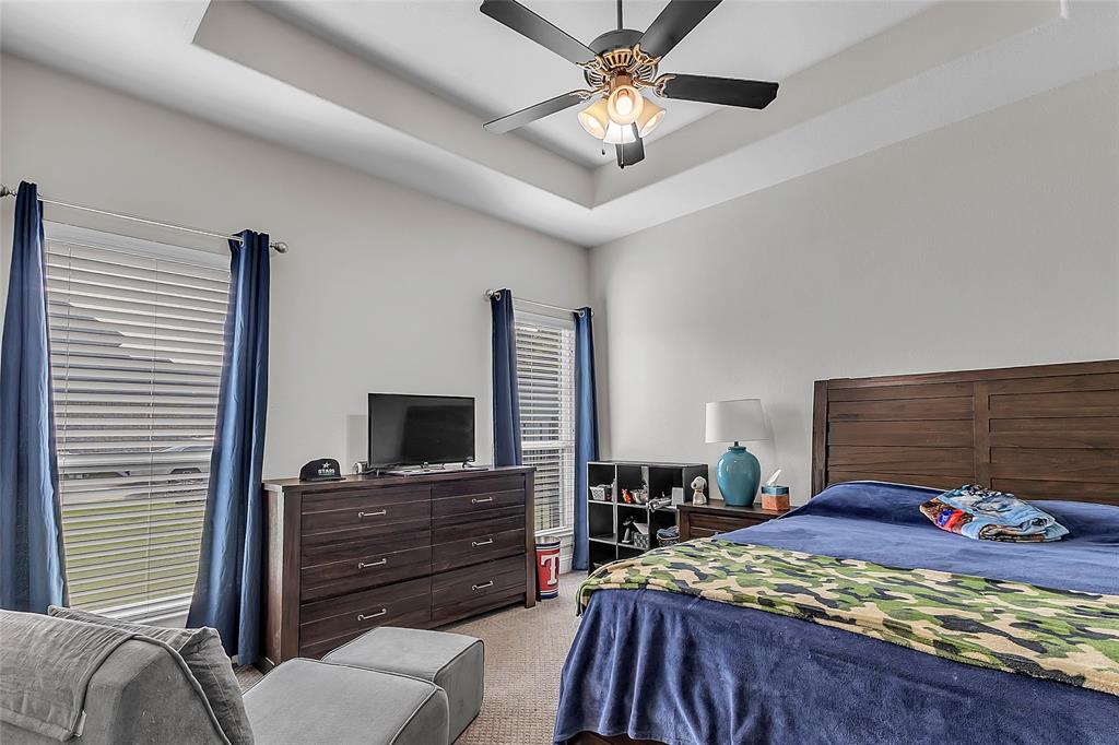 1014 Rennard Street Caddo Mills, TX 75135 - Photo 27 of 39 Recessed tray ceiling with a ceiling fan light fixture