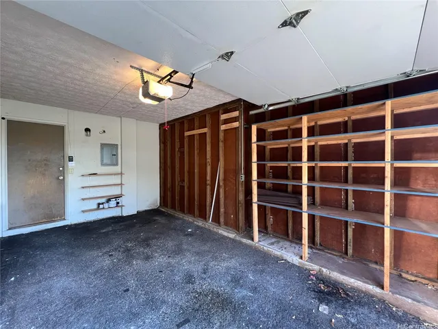 a view of an empty room with a cabinet