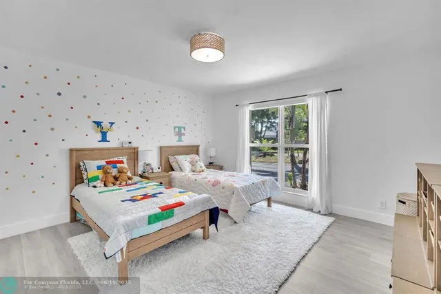 a bathroom with a sink vanity mirror and toilet