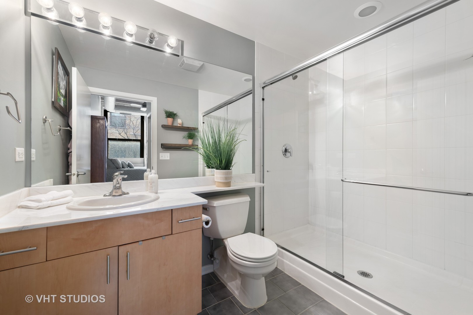 1040 West Adams Street, Unit 248 Chicago, IL 60607 - Photo 13 of 19 a bathroom with a sink toilet and shower