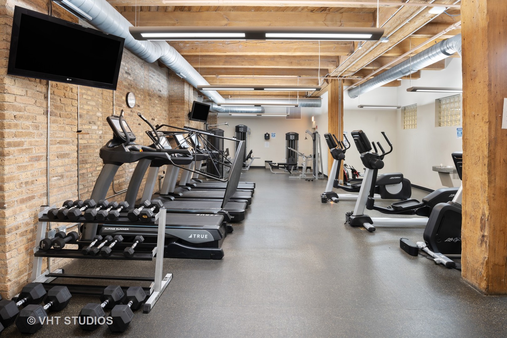 1040 West Adams Street, Unit 248 Chicago, IL 60607 - Photo 18 of 19 a view of a room with gym equipment
