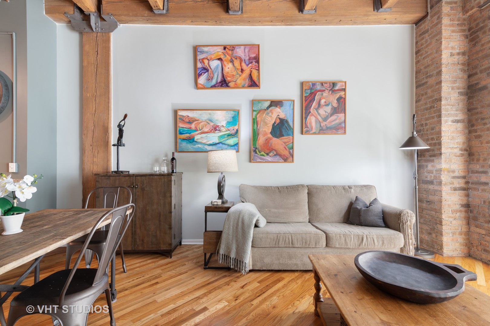 1040 West Adams Street, Unit 248 Chicago, IL 60607 - Photo 6 of 19 a living room with furniture and a wooden floor