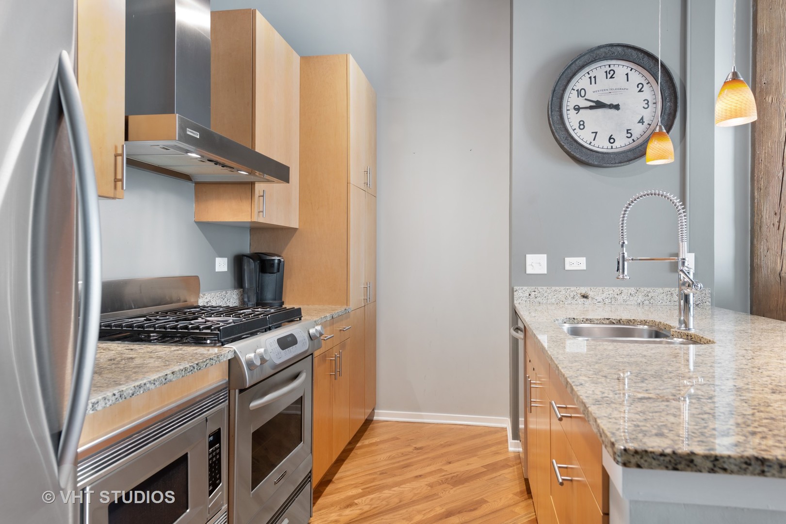 1040 West Adams Street, Unit 248 Chicago, IL 60607 - Photo 9 of 19 a kitchen with stainless steel appliances granite countertop a stove and a sink