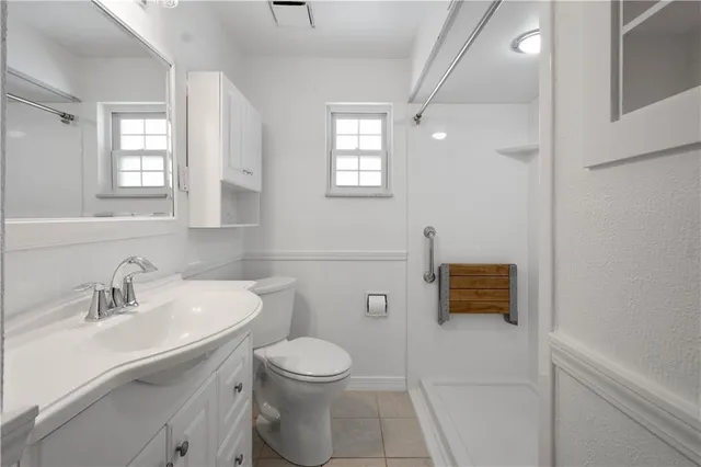 a bathroom with a shower and toilet