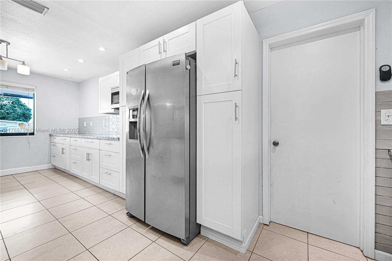 8451 Northwest 10th Street Pembroke Pines, FL 33024 - Photo 12 of 32 a kitchen with stainless steel appliances a refrigerator sink and cabinets