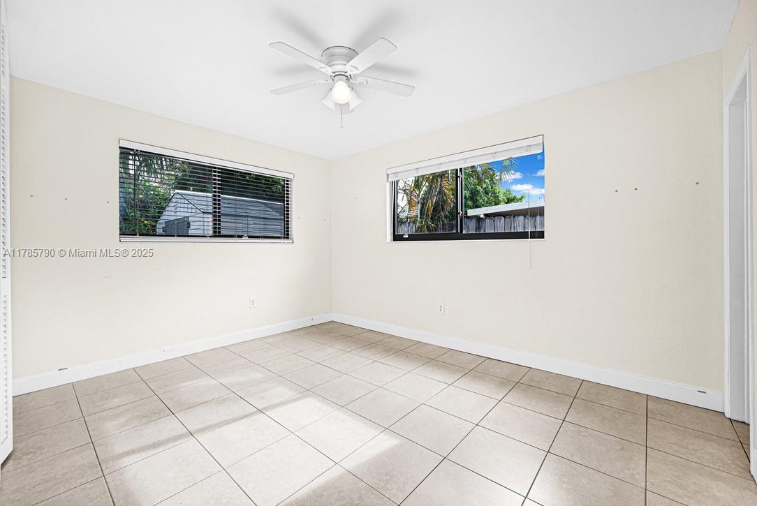 8451 Northwest 10th Street Pembroke Pines, FL 33024 - Photo 14 of 32 an empty room with a window