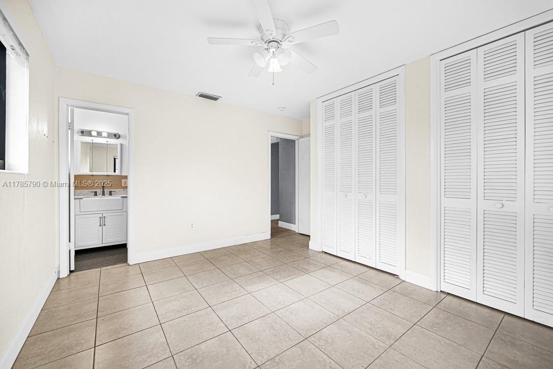 8451 Northwest 10th Street Pembroke Pines, FL 33024 - Photo 15 of 32 a view of an empty room with cabinet and a window