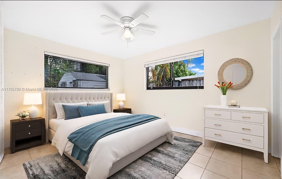 8451 Northwest 10th Street Pembroke Pines, FL 33024 - Photo 2 of 32 a bedroom with a bed and a dresser
