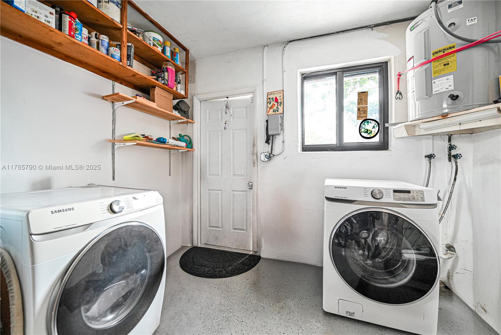 8451 Northwest 10th Street Pembroke Pines, FL 33024 - Photo 28 of 32 a utility room with dryer and washer