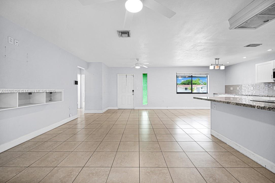 8451 Northwest 10th Street Pembroke Pines, FL 33024 - Photo 8 of 32 a view of a kitchen with an empty space and window