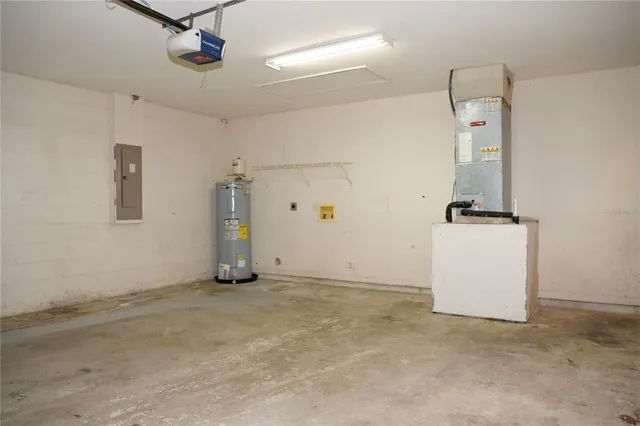 an empty room with ceiling fan and window