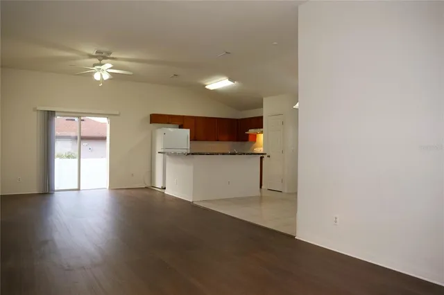 a view of a kitchen with a sink and a cabinet