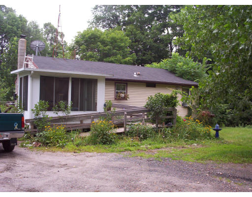120 Hill Road Ashfield, MA 01330 - Photo 1 of 1 a front view of a house with a yard