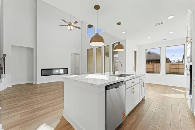 a kitchen with a sink and a stove