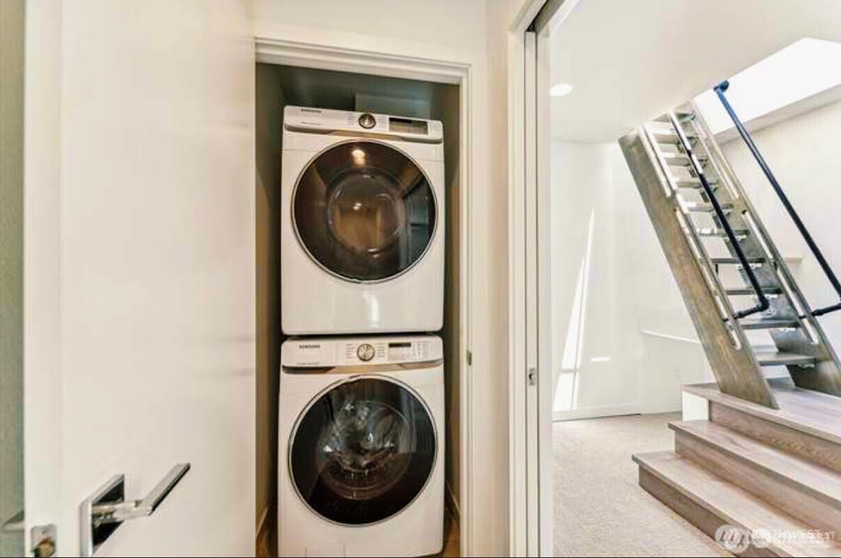 604 Northwest 77th Street, Unit D Seattle, WA 98117 - Photo 3 of 11 a view of a hallway with washer and dryer
