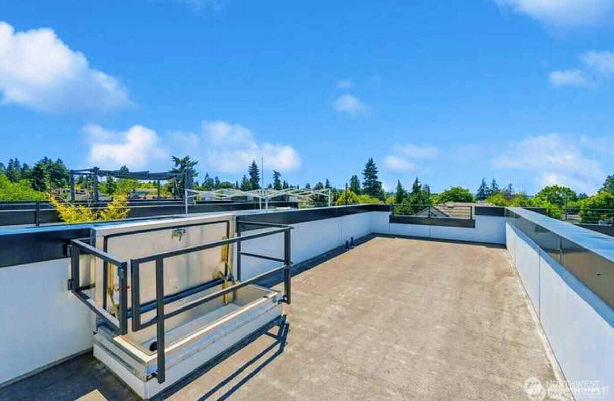 604 Northwest 77th Street, Unit D Seattle, WA 98117 - Photo 5 of 11 a view of a terrace with sitting area