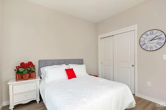 a bedroom with a bed and a chair