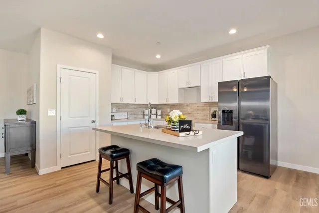 a kitchen with a sink cabinets and window