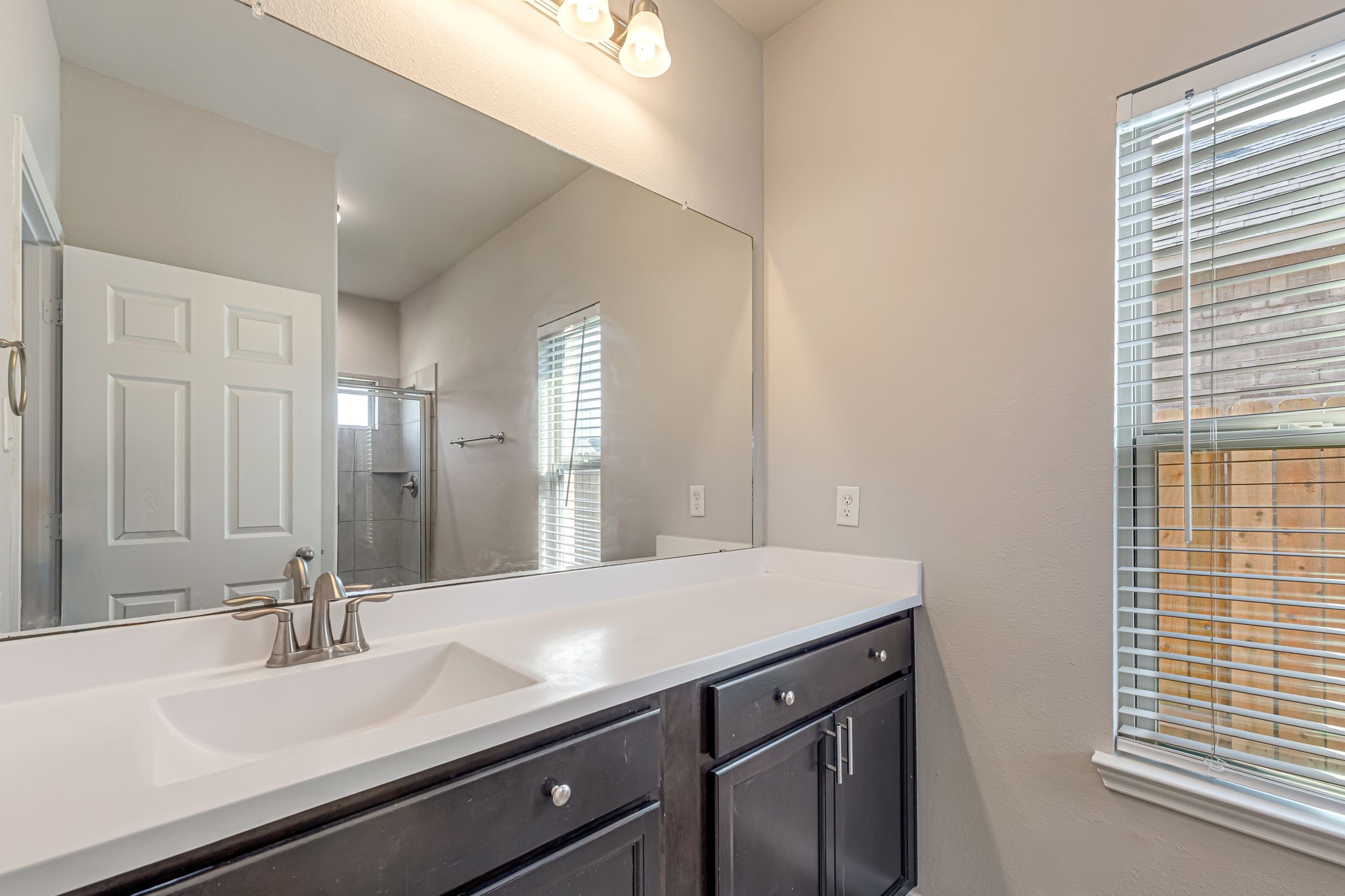 10314 Birch Peak Drive Rosharon, TX 77583 - Photo 23 of 38 a bathroom with a sink and a mirror
