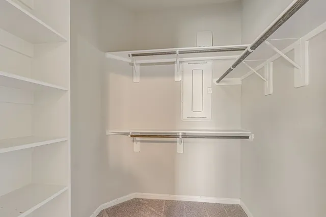a view of an empty walk in closet