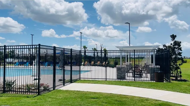 a view of a chair and table in the garden